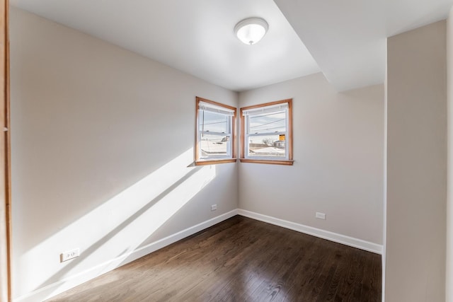 empty room featuring dark wood-type flooring