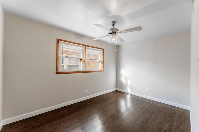 unfurnished room with ceiling fan and dark hardwood / wood-style flooring