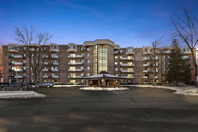 view of outdoor building at dusk