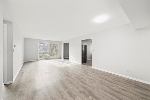 unfurnished living room with light hardwood / wood-style flooring