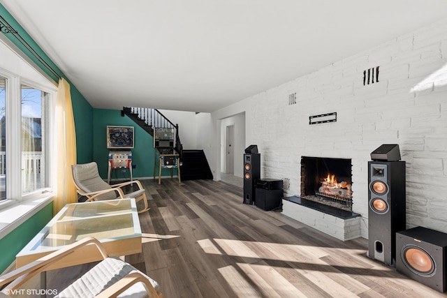 living room with a fireplace and hardwood / wood-style floors