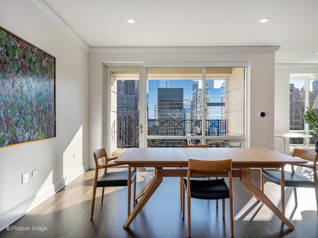 dining area with a wealth of natural light and crown molding