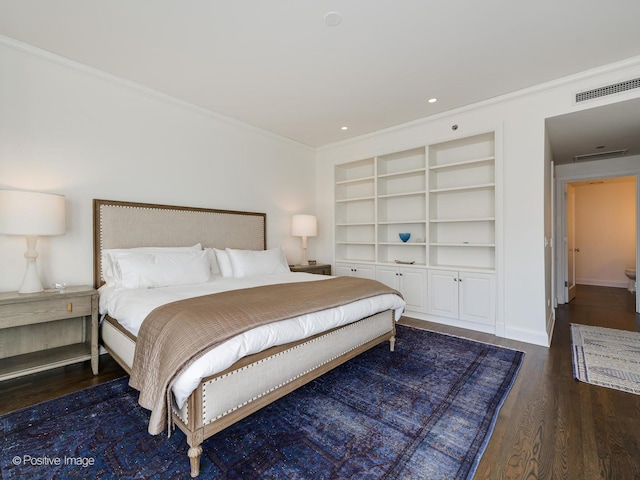 bedroom featuring dark hardwood / wood-style flooring and ornamental molding