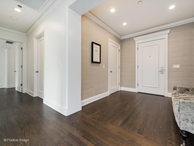 entryway featuring ornamental molding and dark hardwood / wood-style floors