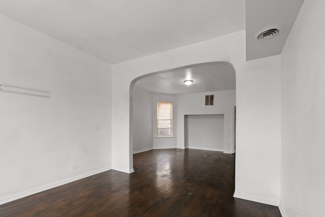 spare room with dark hardwood / wood-style floors