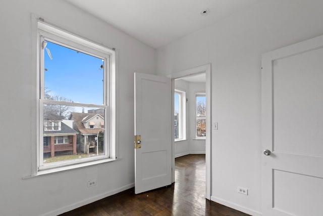 foyer entrance with dark hardwood / wood-style flooring