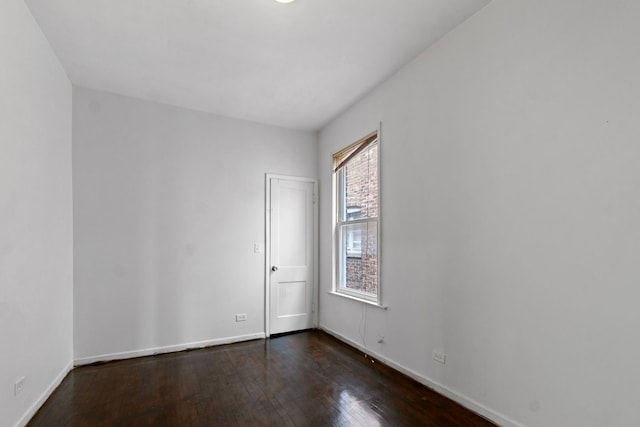 unfurnished room featuring dark hardwood / wood-style floors