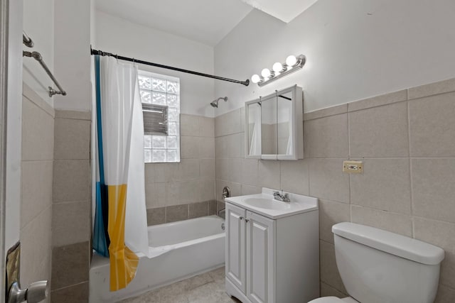 full bathroom featuring toilet, vanity, tile walls, tile patterned flooring, and shower / bathtub combination with curtain