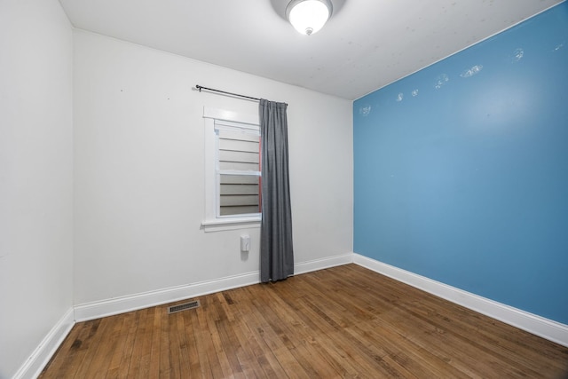 empty room featuring hardwood / wood-style floors