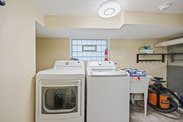 clothes washing area featuring washing machine and clothes dryer