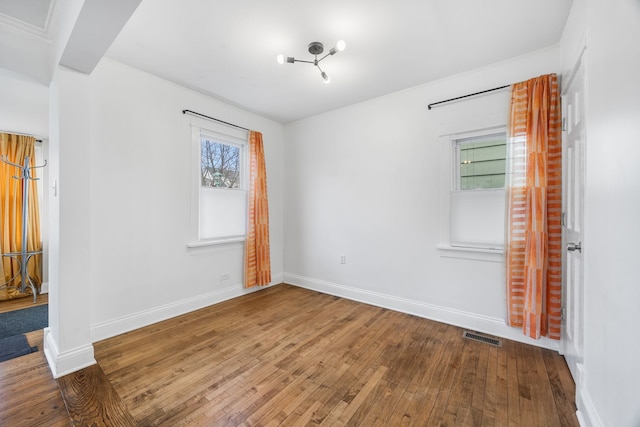 unfurnished room featuring hardwood / wood-style floors