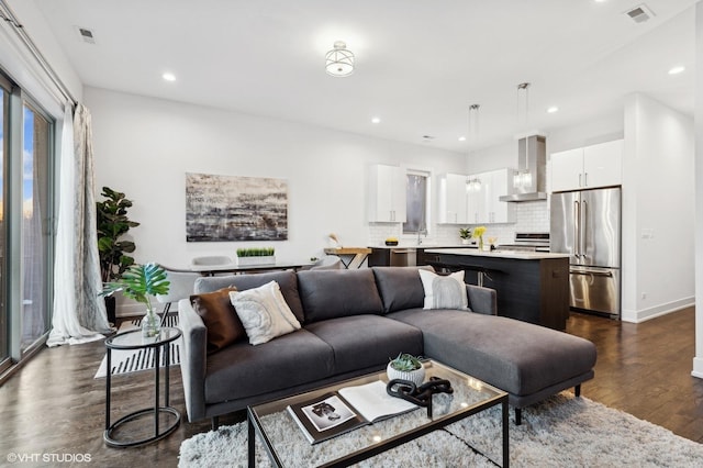 living room with dark hardwood / wood-style flooring