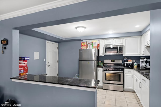 kitchen with kitchen peninsula, crown molding, light tile patterned floors, appliances with stainless steel finishes, and white cabinets