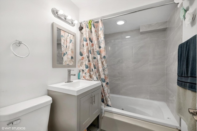 full bathroom featuring toilet, vanity, and shower / tub combo with curtain