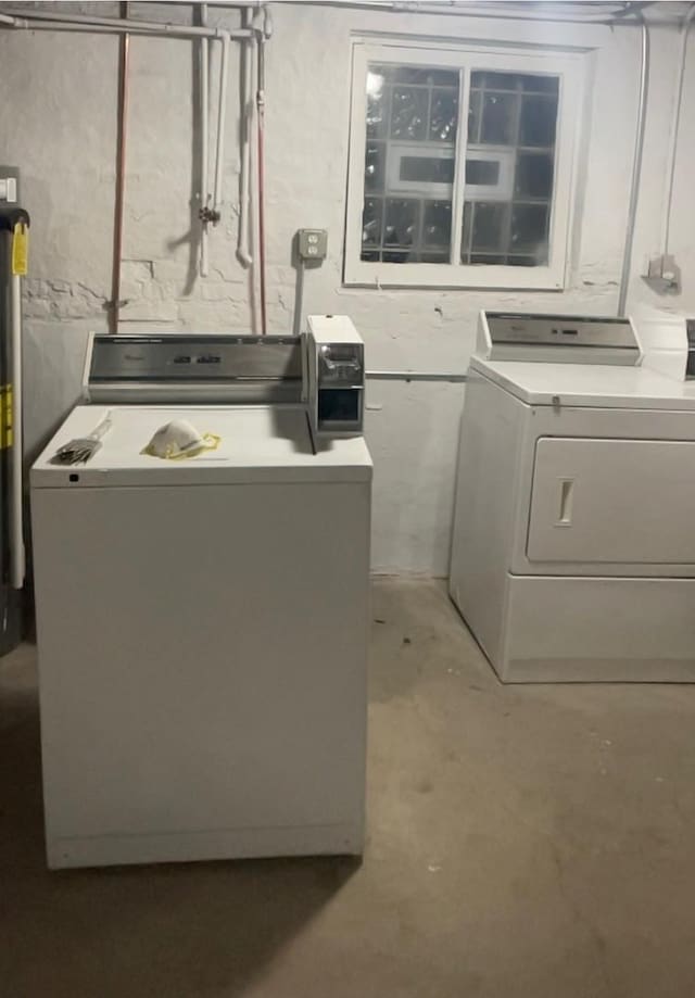 laundry room with independent washer and dryer