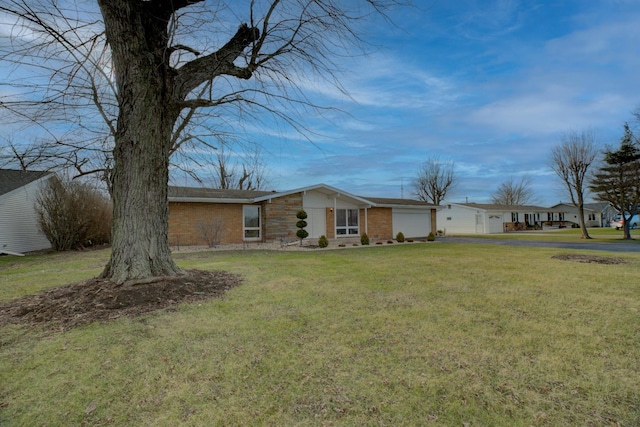 exterior space with a front lawn and a garage