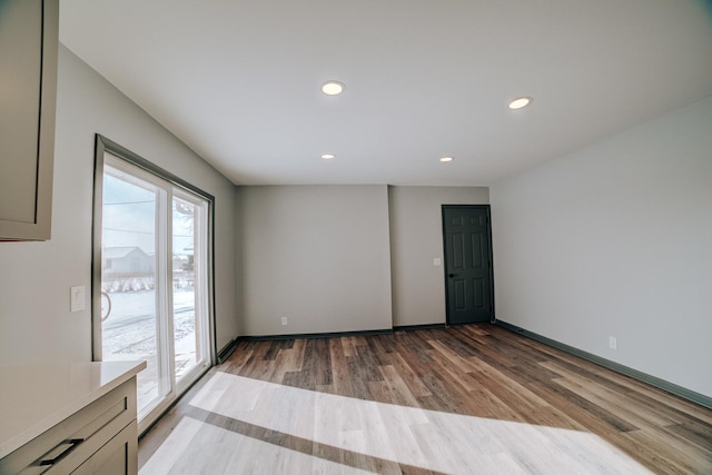 unfurnished room featuring wood-type flooring