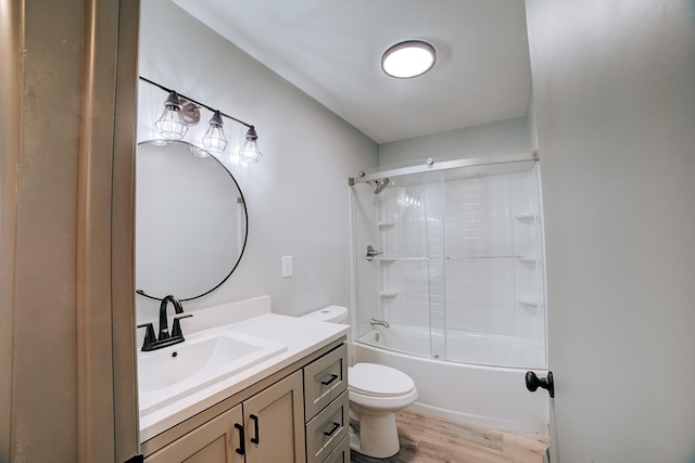 full bathroom featuring tub / shower combination, hardwood / wood-style floors, toilet, and vanity