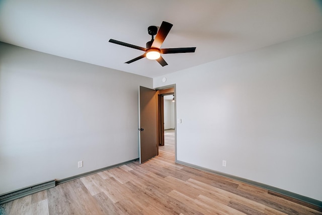 unfurnished room with ceiling fan and light hardwood / wood-style flooring