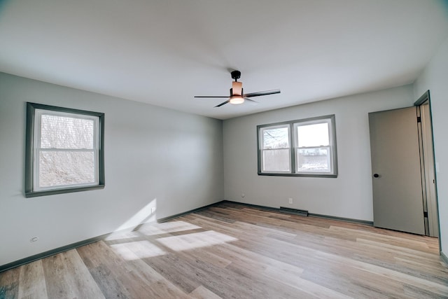 unfurnished room featuring ceiling fan and light hardwood / wood-style flooring