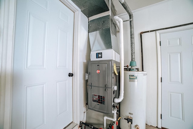 utility room featuring gas water heater