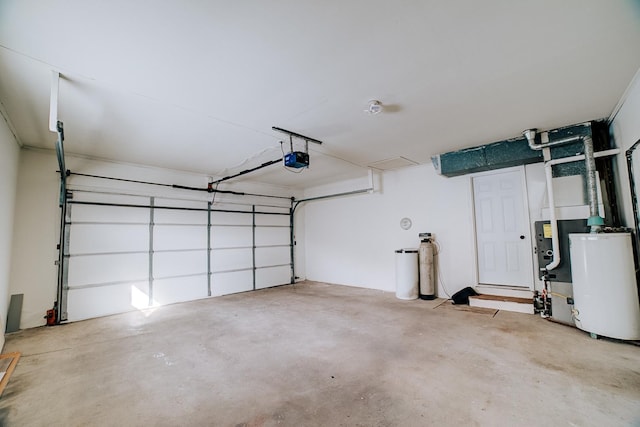 garage featuring a garage door opener and gas water heater