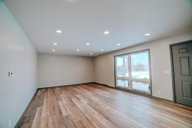 empty room with light hardwood / wood-style floors