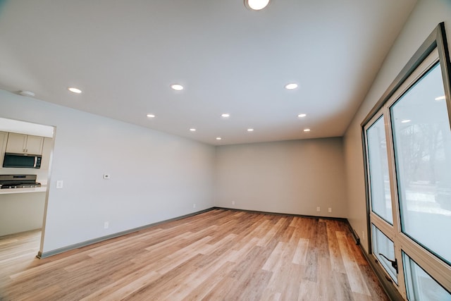 unfurnished room featuring light hardwood / wood-style floors