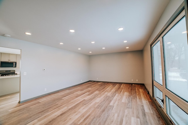 spare room with light wood-type flooring