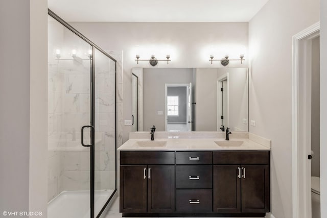 bathroom with vanity, toilet, and an enclosed shower