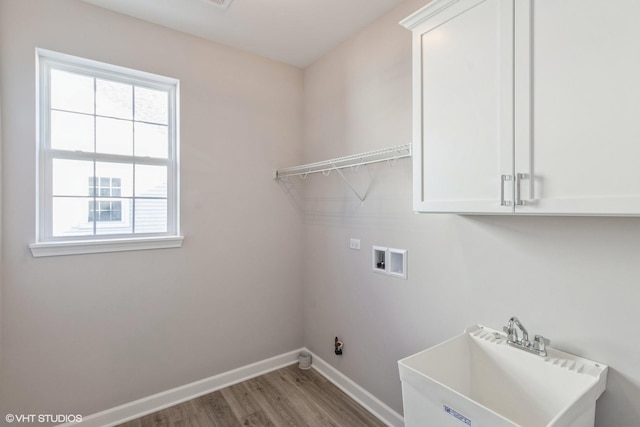 laundry room with sink, a healthy amount of sunlight, washer hookup, and hardwood / wood-style flooring