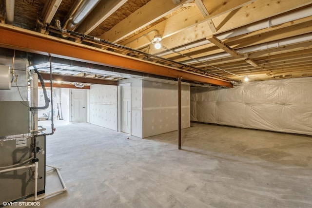 basement featuring heating unit