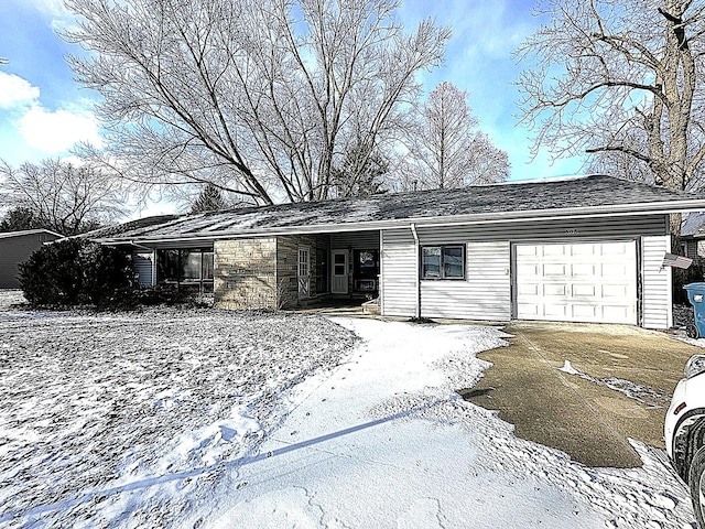 ranch-style home featuring a garage