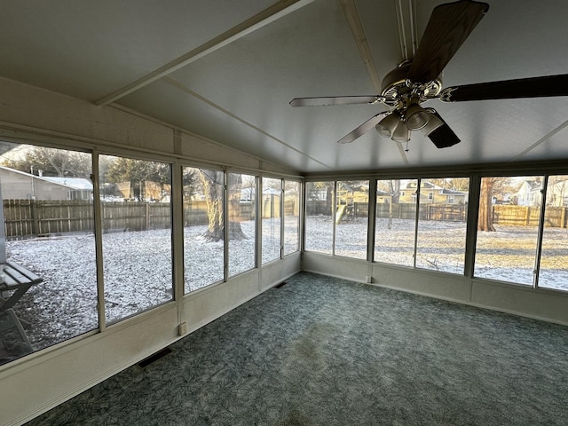 unfurnished sunroom with ceiling fan and lofted ceiling