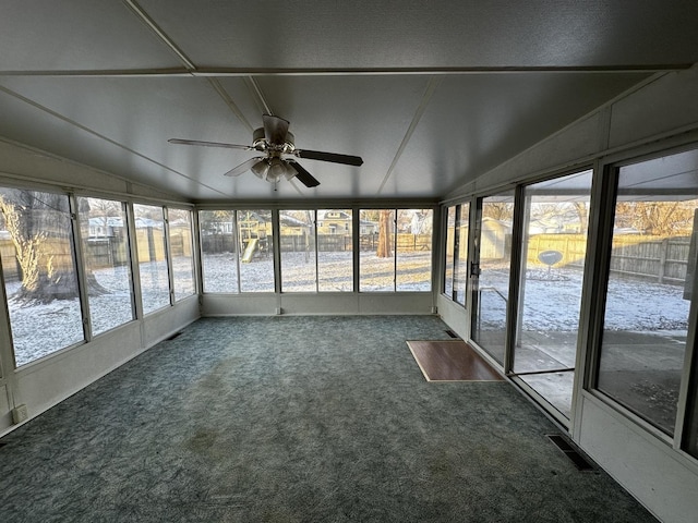 unfurnished sunroom featuring ceiling fan and lofted ceiling