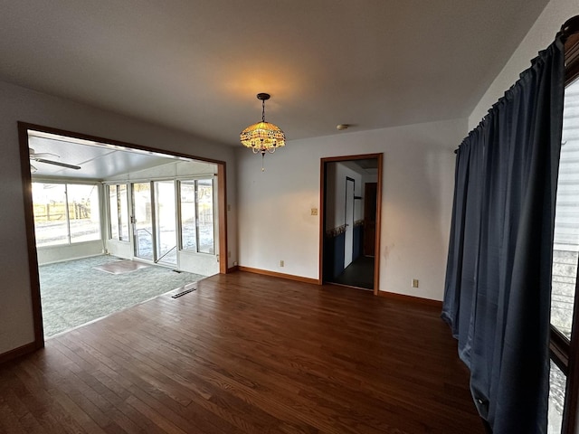 empty room featuring dark hardwood / wood-style flooring