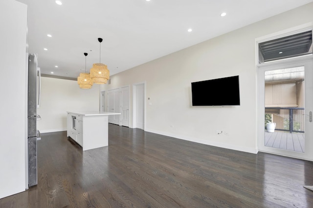 unfurnished living room featuring dark wood-type flooring