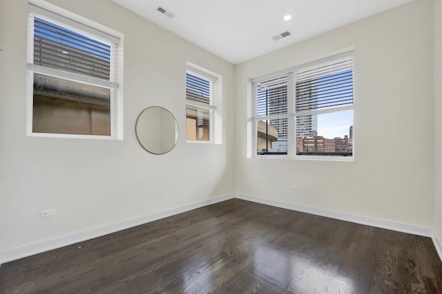 empty room featuring dark hardwood / wood-style floors