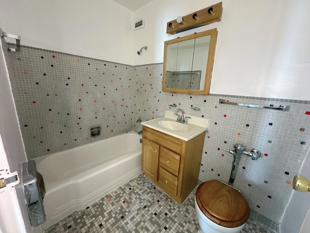 7337 S S Shore Dr Unit 503, Chicago, IL 60649 - bathroom with tile patterned flooring, visible vents, a tub, tile walls, and vanity