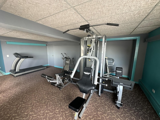 7337 S S Shore Dr Unit 503, Chicago, IL 60649 - exercise area featuring a drop ceiling, baseboards, a baseboard heating unit, and carpet flooring