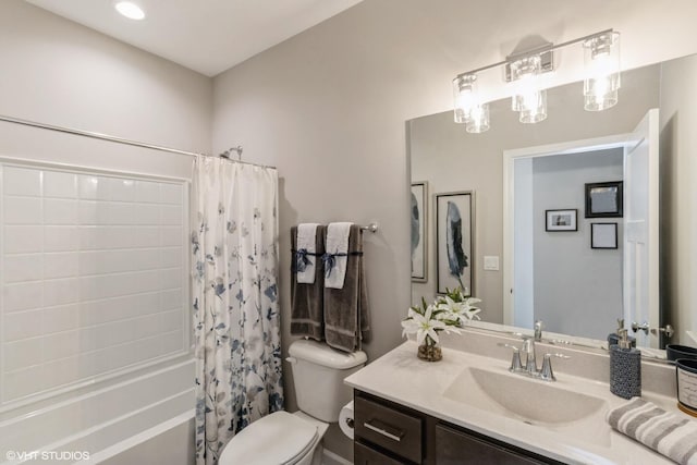 full bathroom featuring toilet, vanity, and shower / tub combo