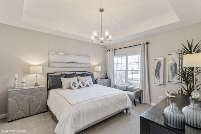 carpeted bedroom featuring a chandelier and a raised ceiling