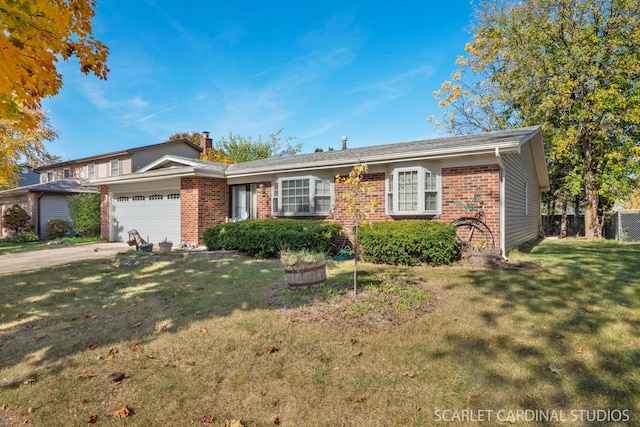 view of front of property featuring a garage and a front yard