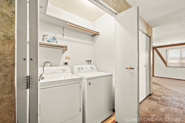 washroom featuring light parquet flooring and washer and dryer