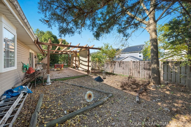 view of yard with a pergola and a deck