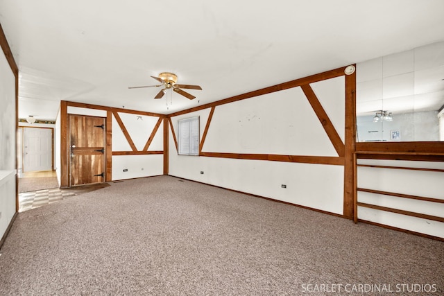 spare room featuring carpet floors and ceiling fan