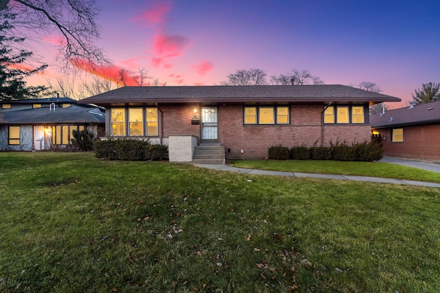 view of front of home with a yard