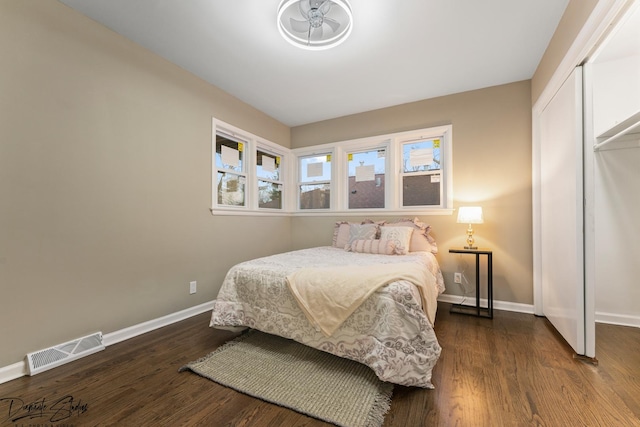 bedroom featuring dark hardwood / wood-style flooring