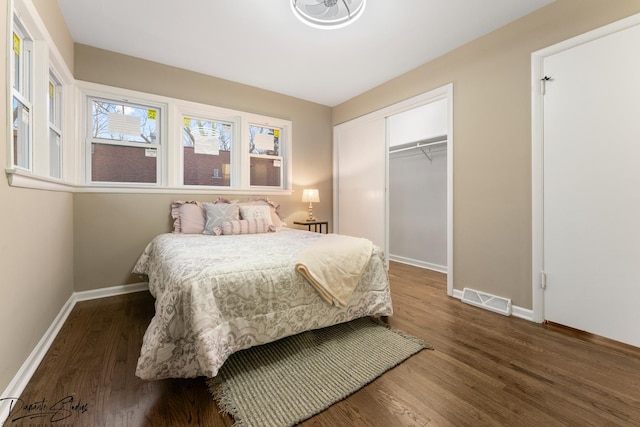 bedroom featuring a closet and dark hardwood / wood-style floors