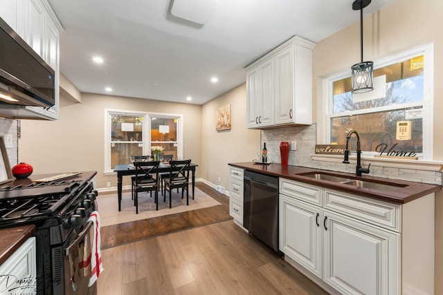 kitchen featuring white cabinetry, gas range, dishwasher, and sink